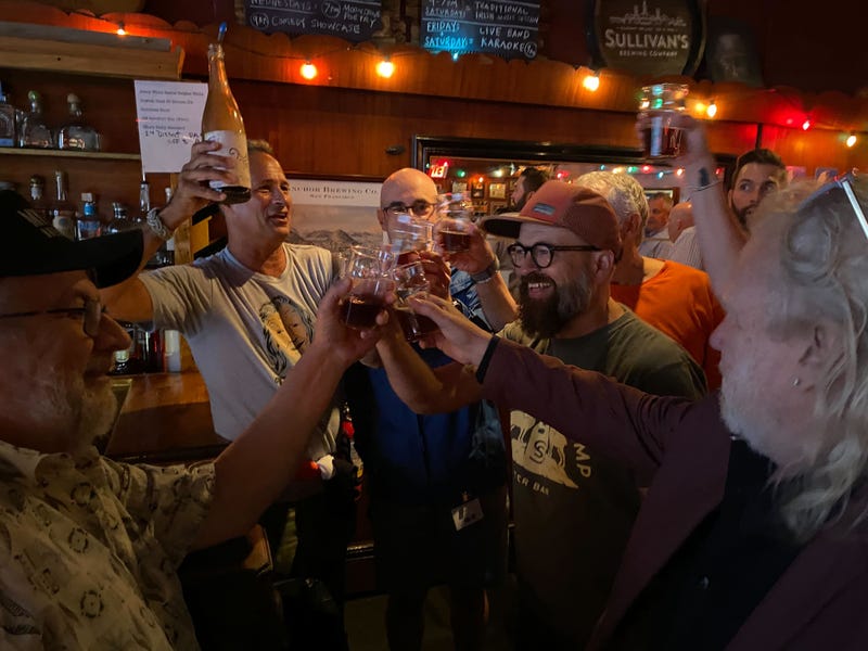 Dogfish Head founder Sam Calagione and others toast to Dr. Pat McGovern.