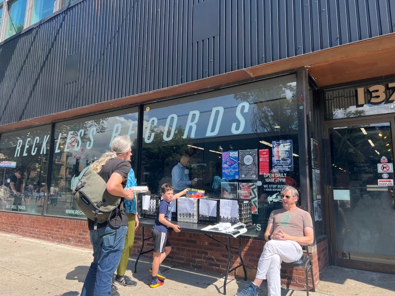 Shoppers browse outside Reckless Records, one of roughly 150 businesses on Milwaukee Avenue participating in "Meet Me on Milwaukee." The pedestrian-friendly pilot series takes place on the last Sunday of each month through October. 