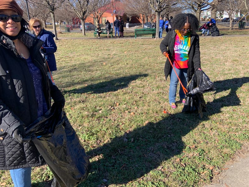Volunteers from an effort organized by Calvary Baptist Church in Chester clean up Martin Luther King, Jr. Park during an MLK Day event Monday.