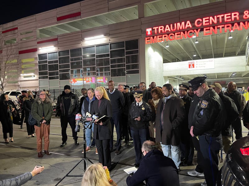 Police personnel, others gather outside Temple University Hospital, where a Temple University police officer died after being shot Saturday night near North 18th Street and West Montgomery Avenue.