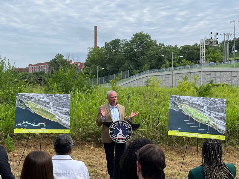 Tim Kaine speaks at the location of the new park