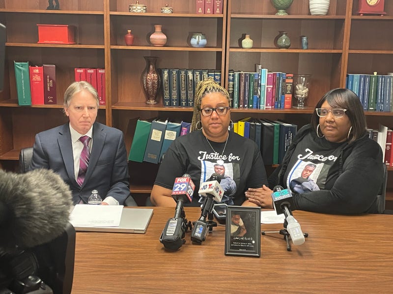 From left: Attorney Paul Hetznecker, Tahiem Weeks-Cook's mother Stacy Weeks, and her sister Terra Johnson