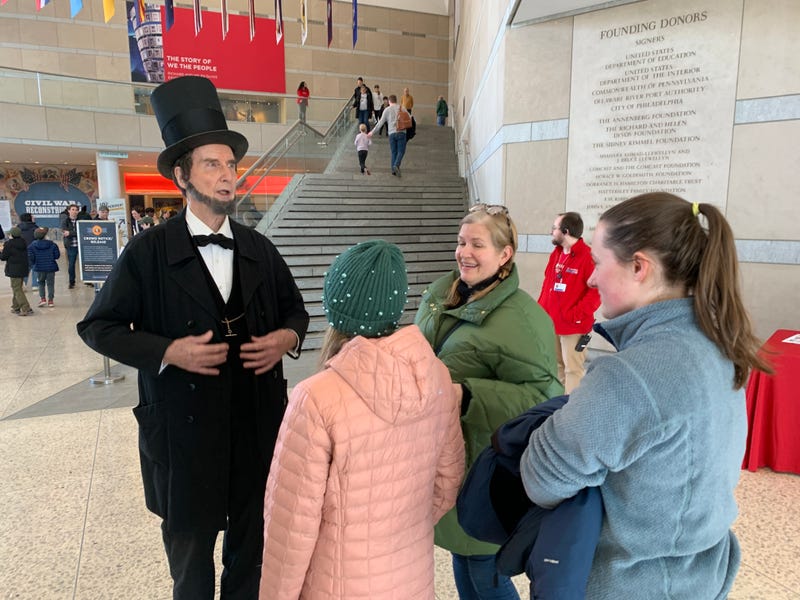 Actor portraying Abraham Lincoln greeted visitors at the Constitution Center’s free admission Monday