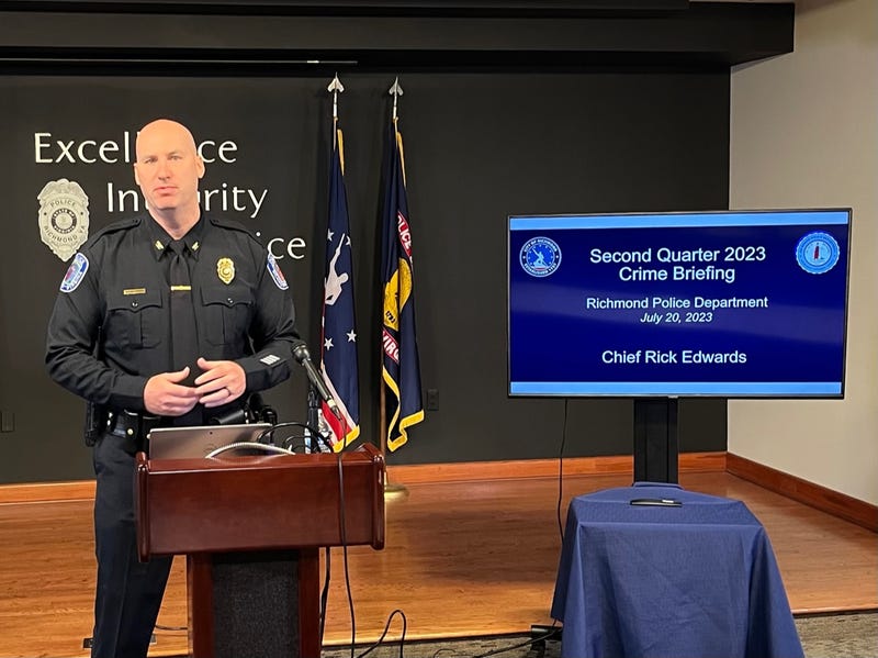 A police officer giving a power point presentation