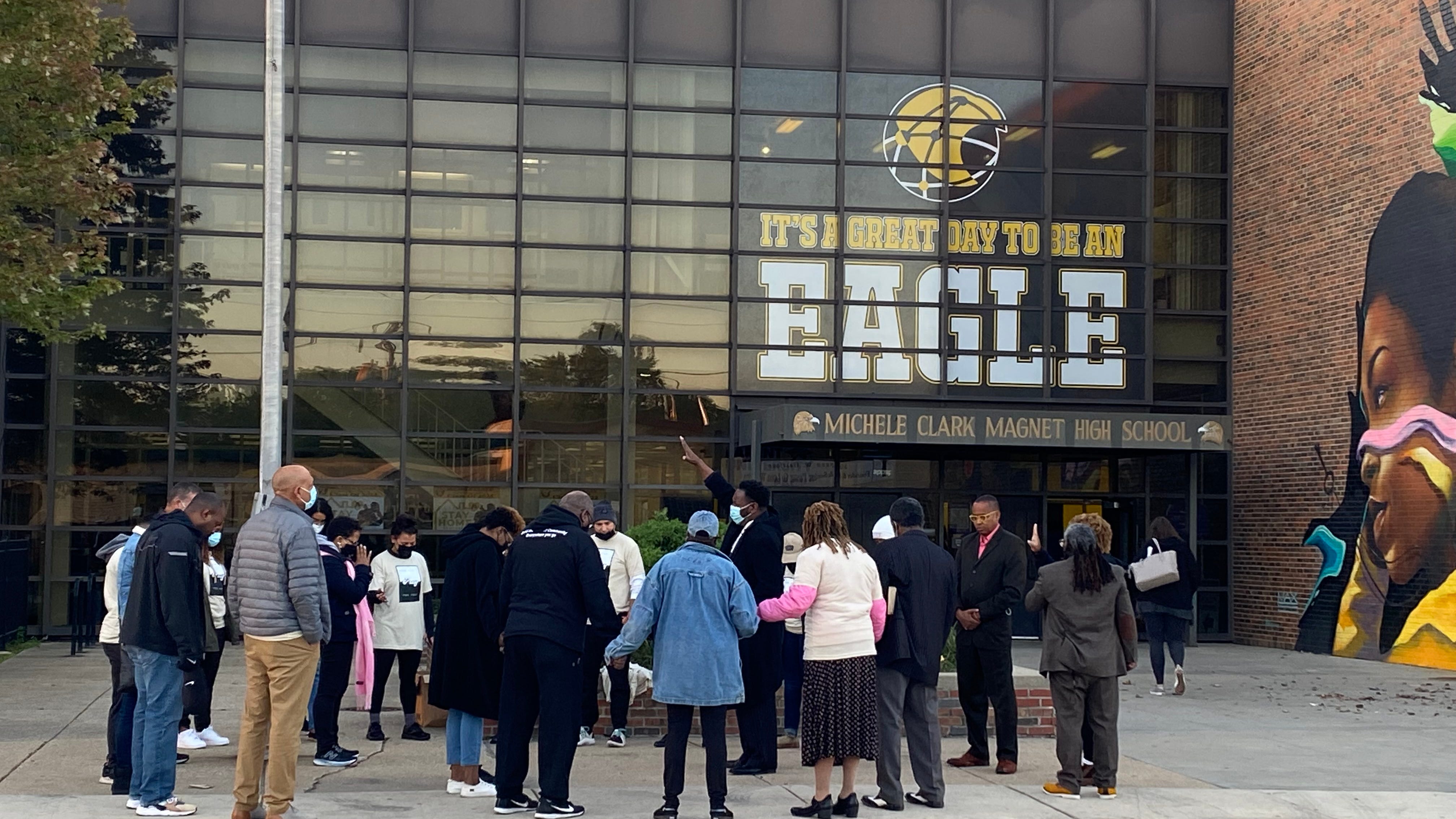 Church leaders pray with Michele Clark students following fatal shooting of Kierra Moore