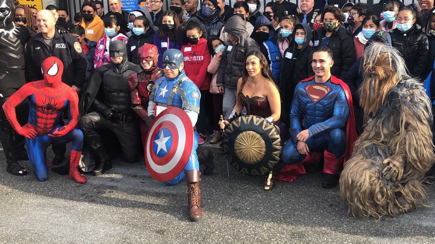 Nassau cops dress as superheroes to take underprivileged children Christmas shopping