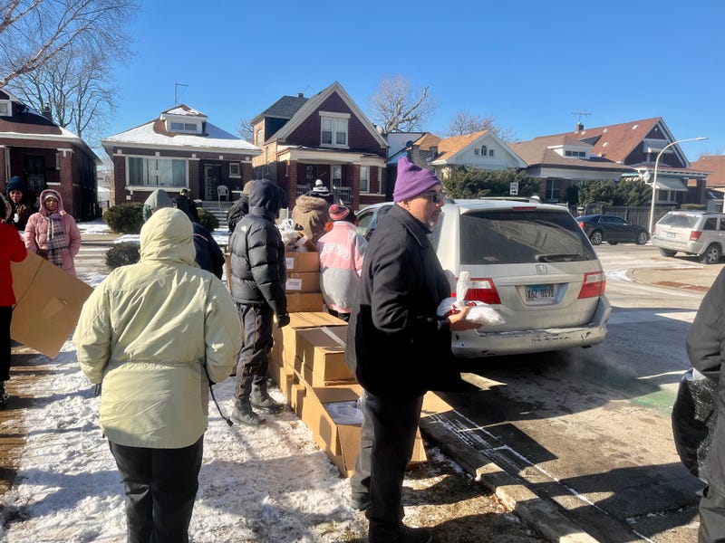 volunteers distributing meals at St. Sabina