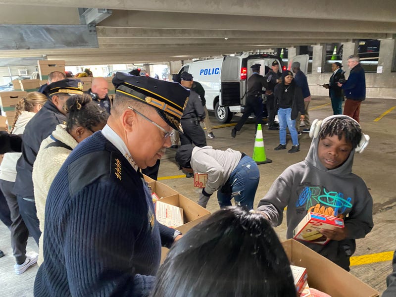 Police Commissioner Kevin Bethel helps pack dinner boxes for families in need as part of the 58th annual Operation Thanksgiving, Nov. 26, 2024.