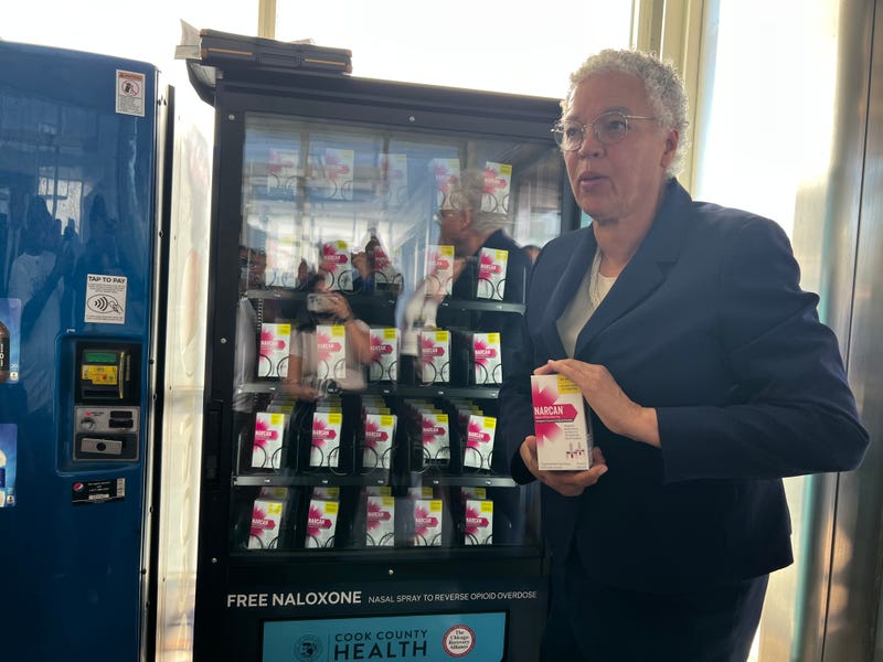 Cook County Board President Toni Preckwinkle holds up a box of naloxone, or Narcan, at the naloxone vending machine at the CTA 47th Street Red Line Station. Cook County Health and the CTA launched vending machines at five CTA stations throughout the city. 