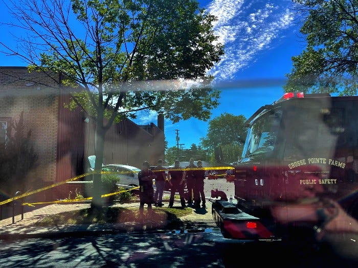 Authorities are trying to determine what caused a fiery crash Saturday morning after a vehicle struck an over 100-year-old postal building and bust into flames in Wayne County.