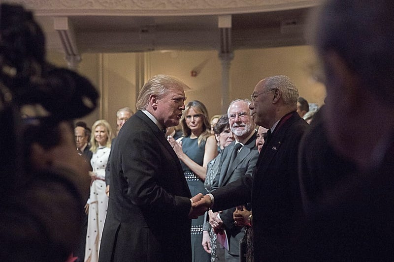 U.S. President Donald Trump, center left, shakes hands with Colin Powell, former U.S. secretary of state, during the Ford's Theatre Gala in Washington, D.C., U.S., on Sunday, June 2, 2019.