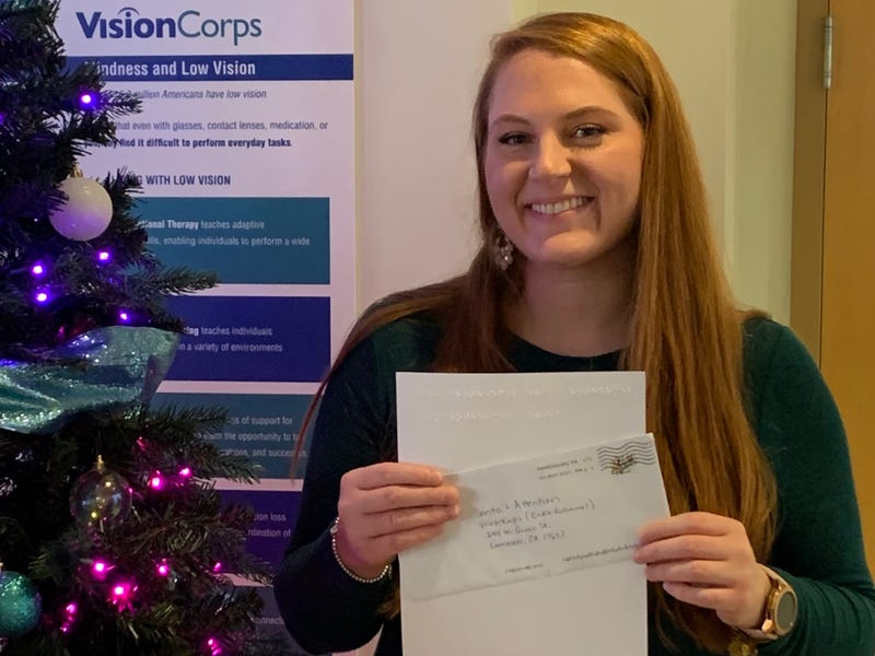 Erika Rothermel holding letters to santa 