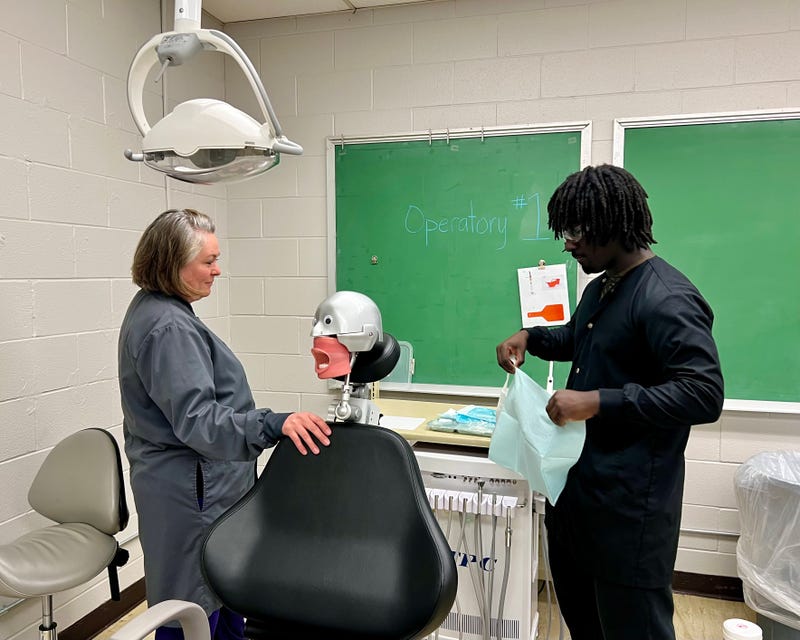 A high school student prepares for a filling in the dental assistant program at Collinsville Area Vocational Center, Collinsville, IL