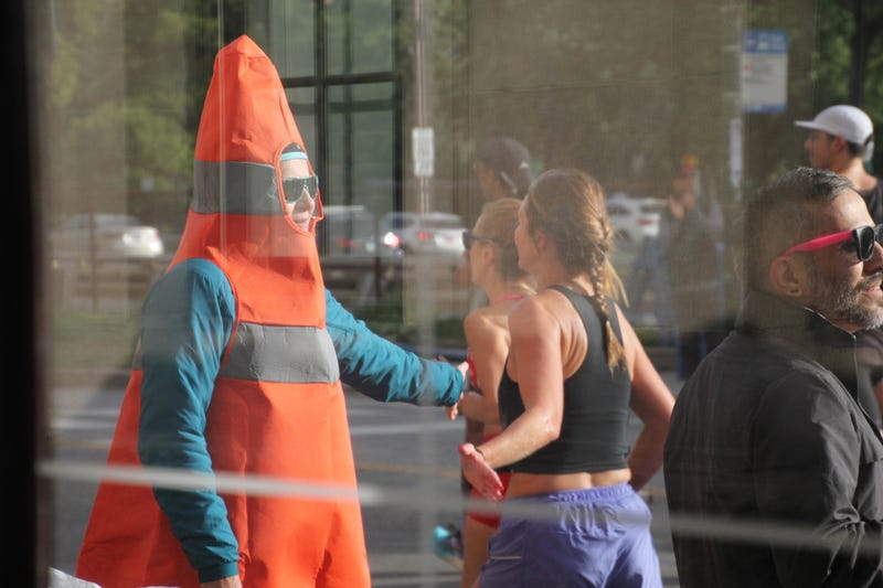 Supporters line the streets of Chicago as thousands of racers run through the Chicago Marathon.