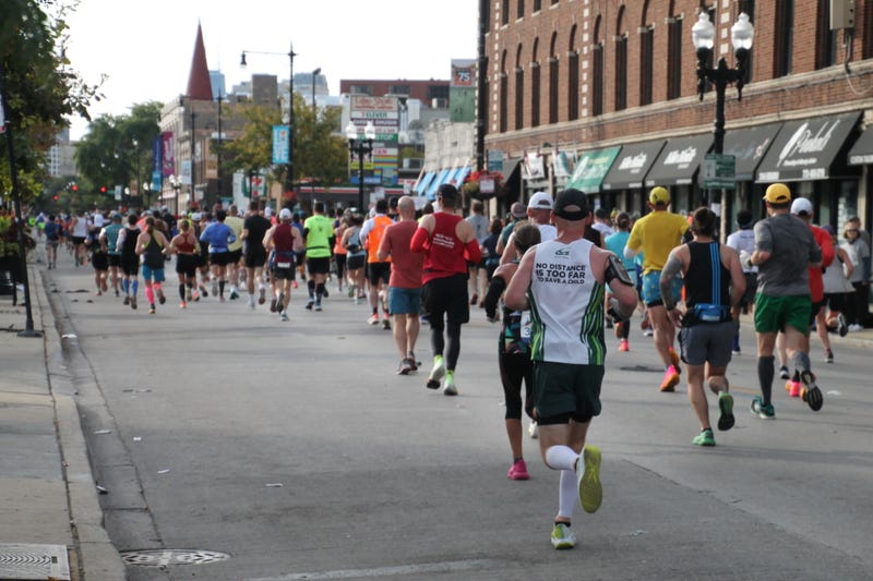 Runners make their way south on Broadway on Chicago's North Side during the 2023 Chicago Marathon.  