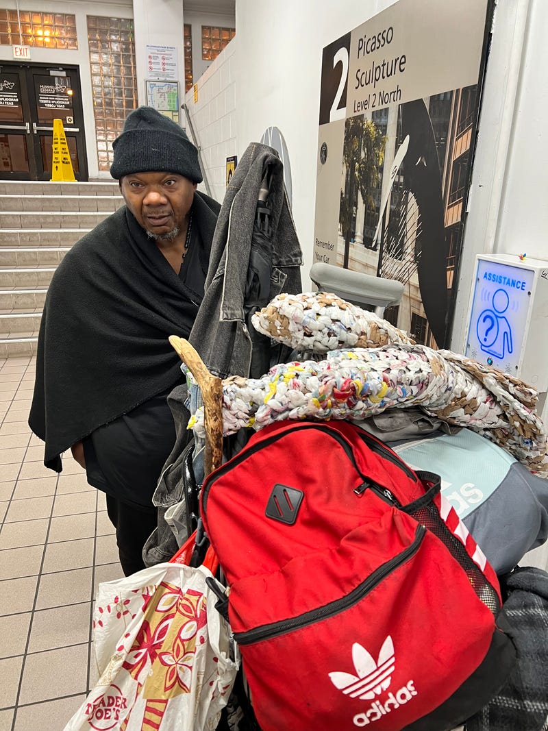 Michael Hudson with a mat made by Bags and Mats for Those in Need