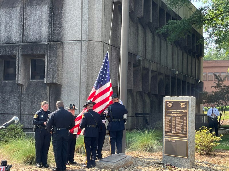 Ceremonial raising of the flag to half mast at the Greenville County Sheriff's Office memorial ceremony