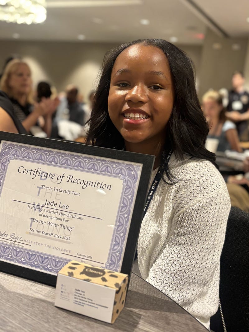 Jade Lee with her Certificate of Recognition after winning the "Do the Write Thing" writing contest. Her essay was chosen among over 800 essays submitted by CPS students to represent Chicago in the national campaign.