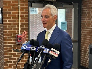 Rahm Emanuel talks with reporters at Rickover Naval Academy High School