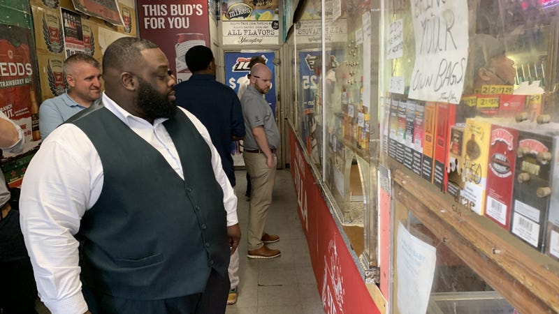 State Rep. Jordan Harris observes operations at a 'stop and go' store in Southwest Philadelphia.