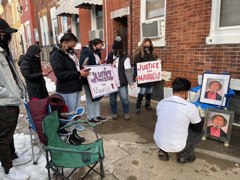 Friends and family members of 83-year-old Mauricio Gesmundo hold a vigil in front of his Hunting Park home. Gesmundo was brutally beaten on New Year's Eve and later died from his injuries.