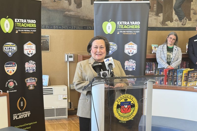 woman speaking at press conference