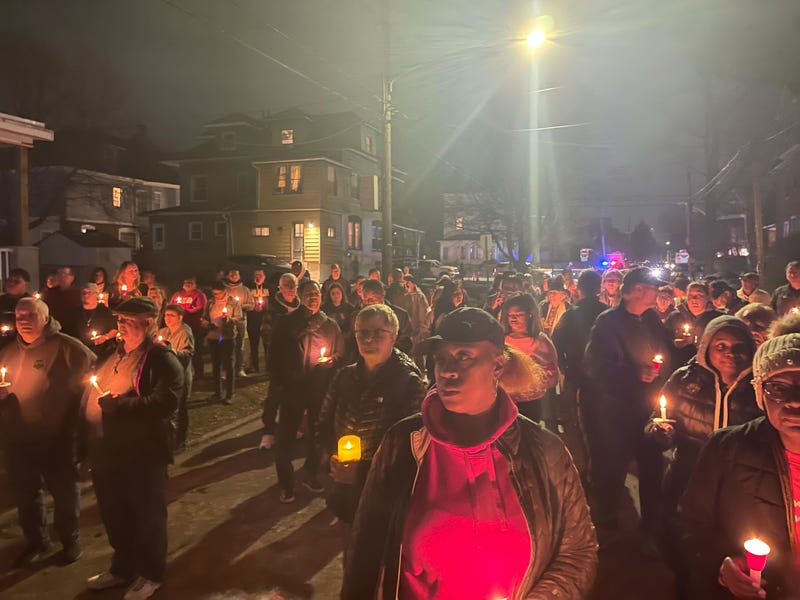 More than 100 people gathered for a candlelight vigil Saturday to remember the Le family.