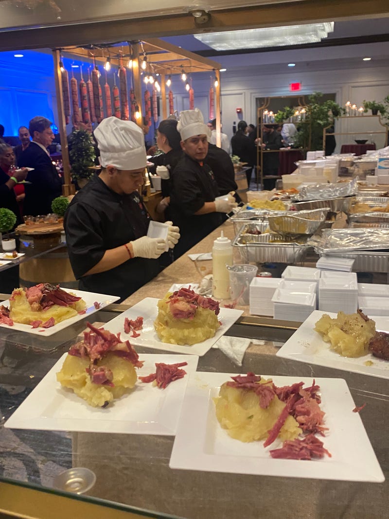 Chefs prepare various fare, including mashed potato-and-pastrami hors d'oeuvres, at the 2024 Kosher Food & Wine Experience at the Hilton Meadowlands in New Jersey.