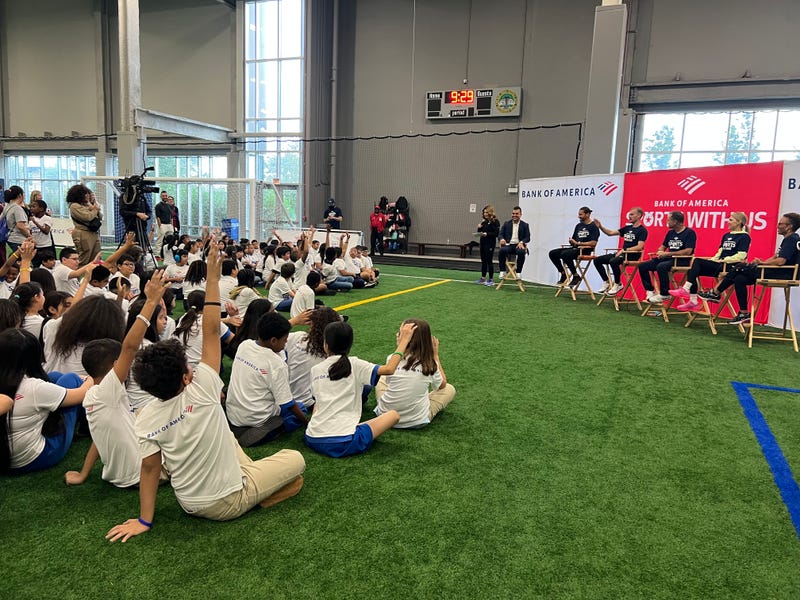 A group of Pilsen-area students attend Bank of America's Sports with Us clinic with professional athletes. 