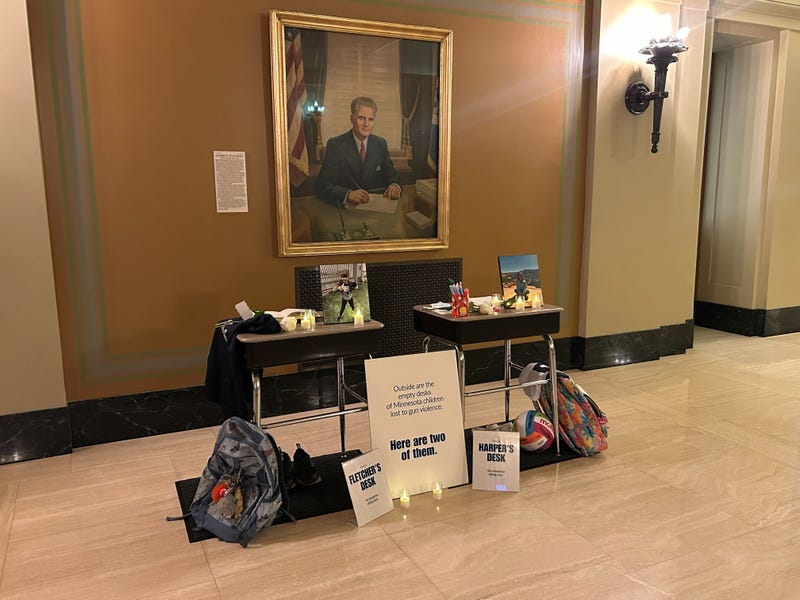 Annunciation parents set-up 60 empty desks which will be displayed outside the Minnesota State Capitol from February 24 to 26, and also two for the students that were killed in the mass shooting last August, Fletcher Merkel and Harper Moyski.