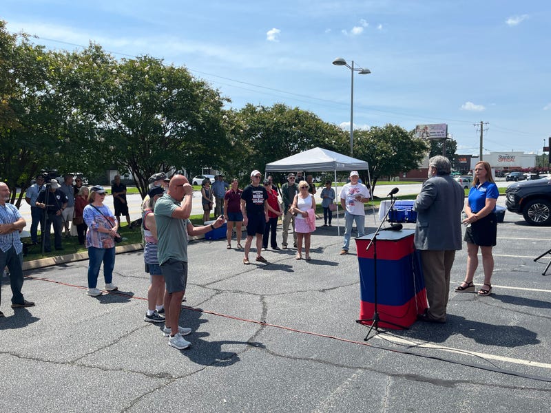 A crowd gathered at the Only Citizens Vote bus tour