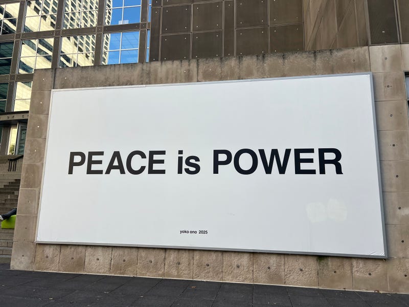 "Peace is Power" billboard on the MCA Plaza outside of the museum. "Yoko Ono: Music of the Mind" opens Oct. 18 at the MCA.