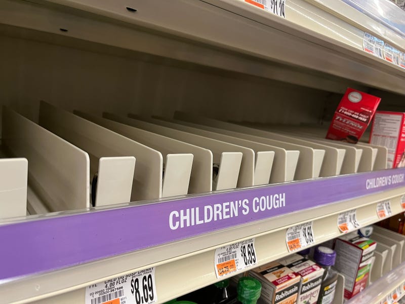 An empty children's cough medicine shelf at a drugstore