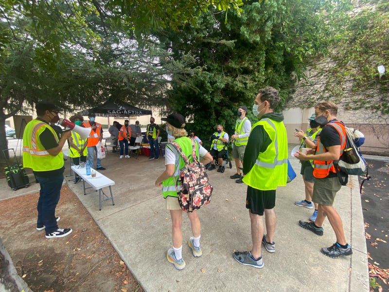 Terry Wilkerson (left) leads the morning meeting before the picketing commences. 