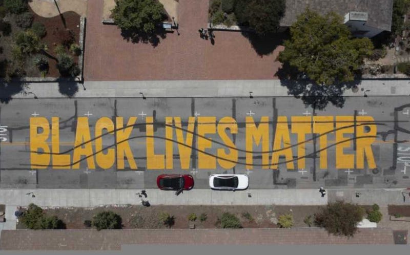 The large, street-size mural seen defaced from above.