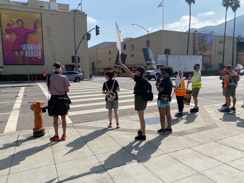 Picketers outside Warner Bros. Studios in Burbank. The three girls in the black shirts, (from L to R) Conner, Devin, and Julyza, chant, "Jen and Drew, how dare you!”
