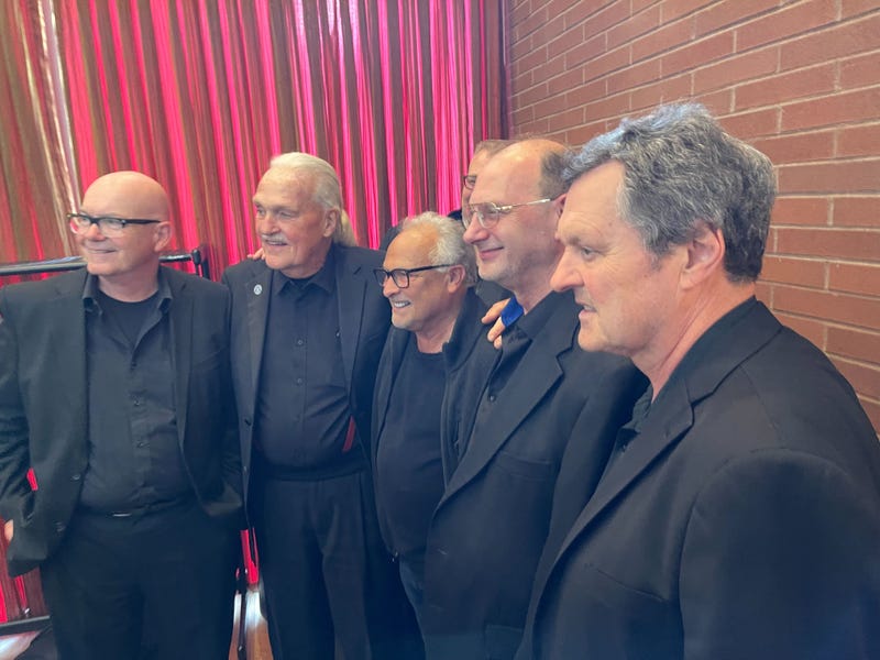 Jed Nero, son of Peter Nero, stands with musicians from No Name Pops.