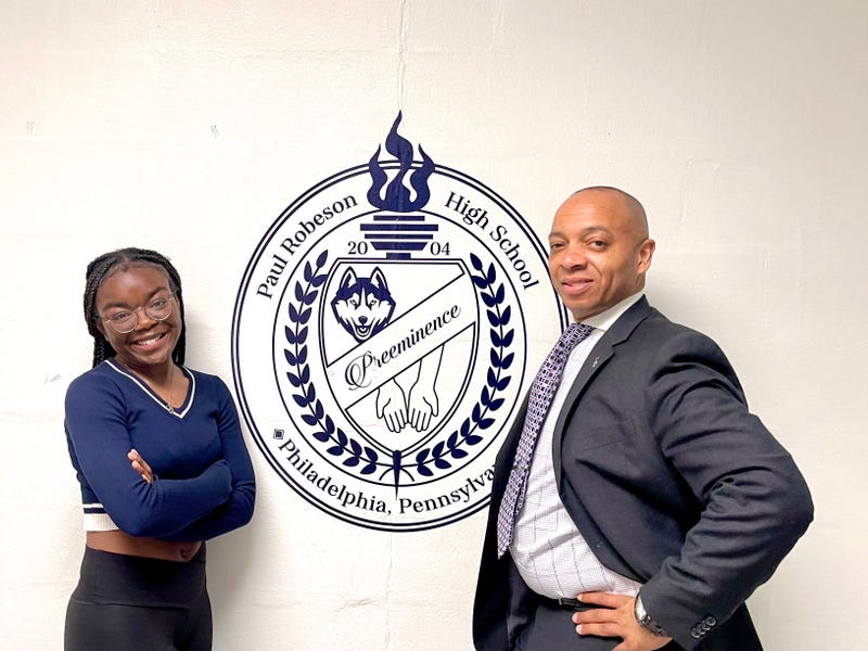 Alyssa Perren (standing with principal and mentor Richard Gordon) is the first student from Paul Robeson High School to be accepted to Harvard University.