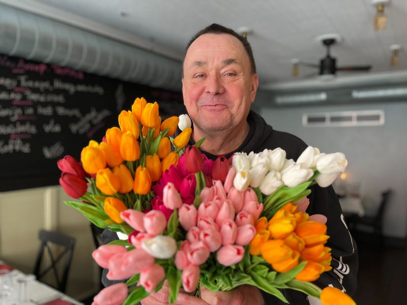 Joncarl Lachman poses with his restaurant tulips.