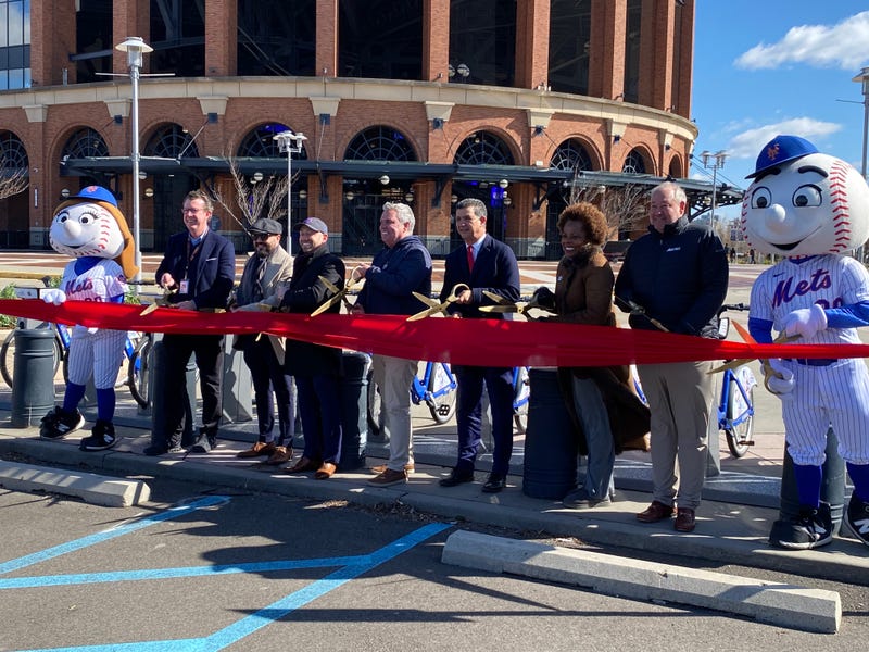 Mr. and Mrs. Met, along with NYC Dept. of Transportation commissioner Ydanis Rodríguez (4th from right), NYC councilor Francisco Moya (third from left) and executives from the Mets, Citi and Lyft, take part in a ribbon-cutting ceremony marking the debut of Citi Bike at Citi Field on March 21, 2024.