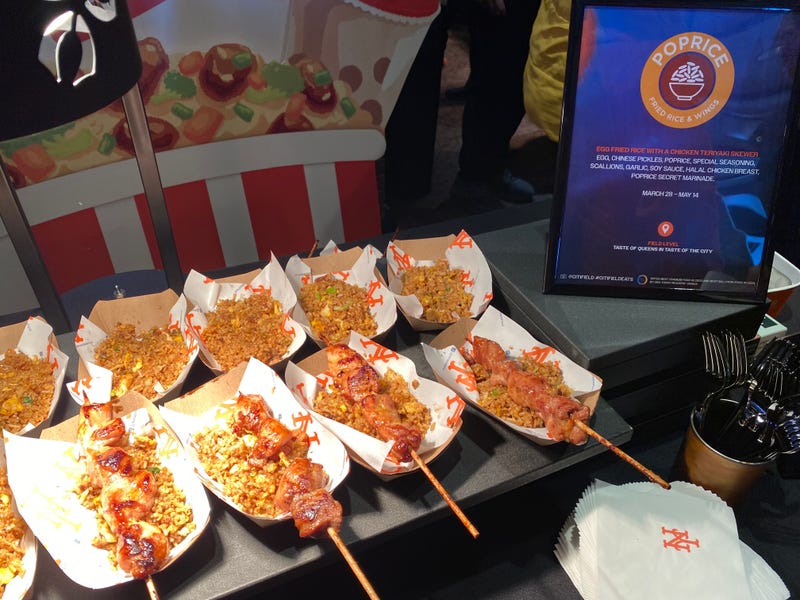 Poprice, which is an Asian street food eatery in Fresh Meadows, will be at Citi Field from March 28 to May 14. Pictured here, at the Met's 'What's New in 24' event on March 21, 2024 at Citi Field, is egg fried rice with a chicken teriyaki skewer.