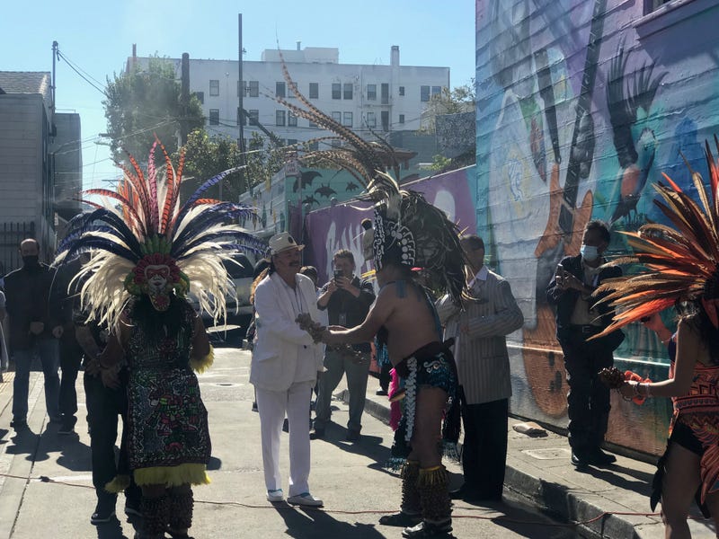 San Francisco’s Mission District has a new bit of musical history, as local artists dedicated a mural of Carlos Santana and his family right outside the 24th Street BART station entrance on Friday.
