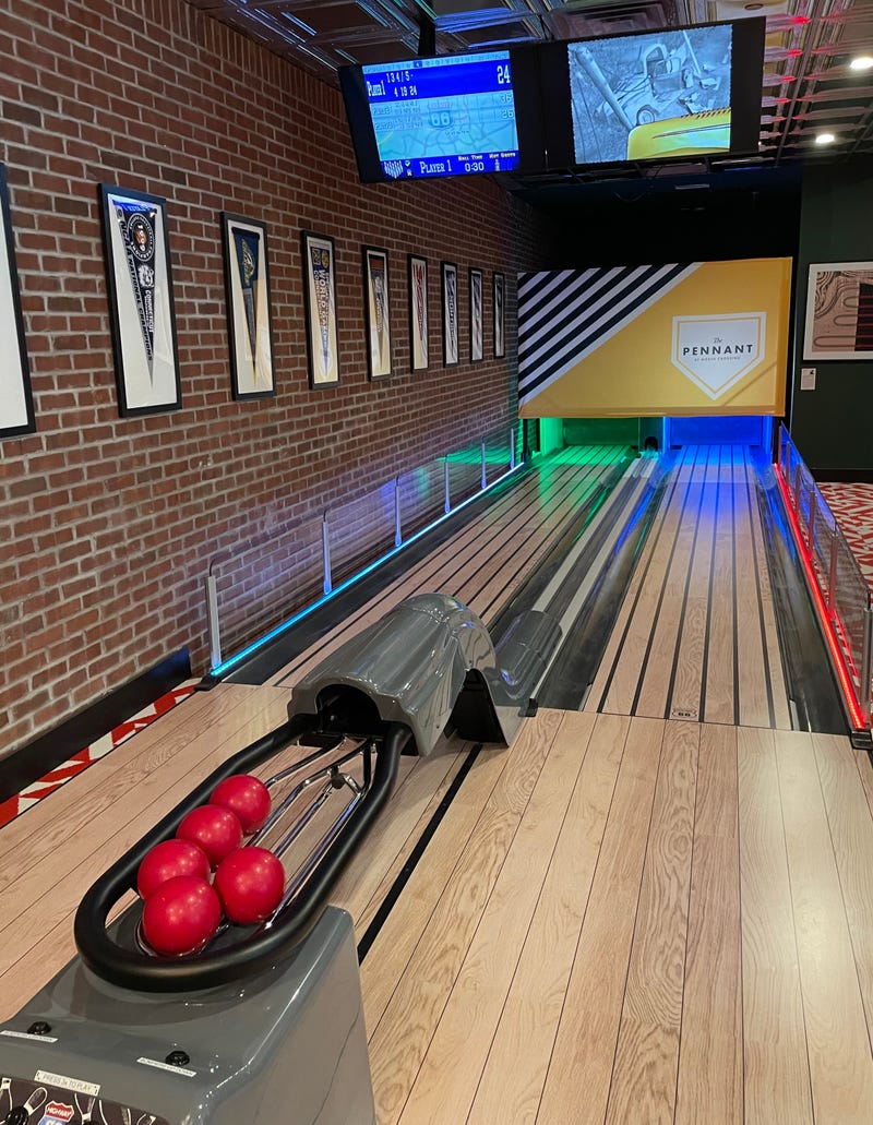Tenants can take advantage of the bowling alley in The Pennant, a new apartment building in Hartford's North Crossing development.
