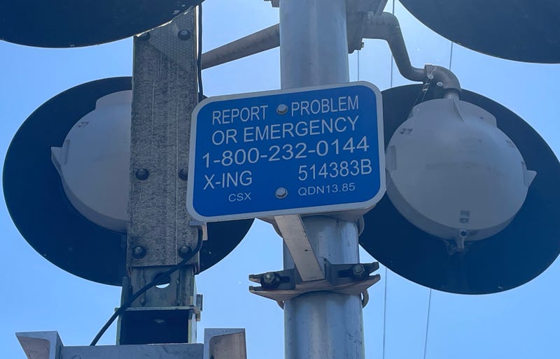 Emergency number to report a problem at railway crossings