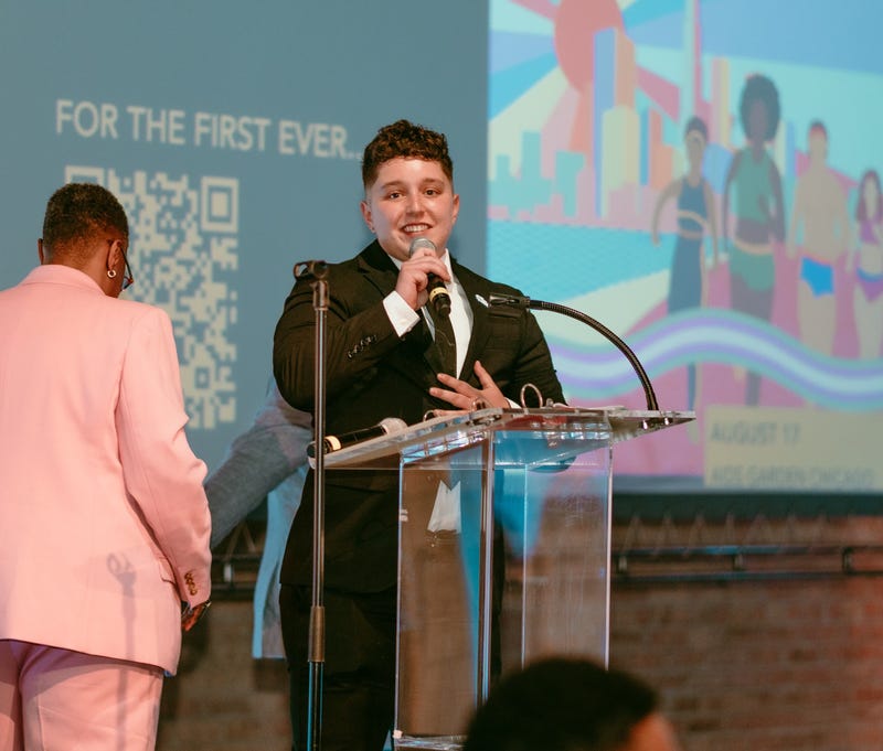 Troy Taylor announces the Dignity Dash at the Brave Space Alliance's Soiree. The race will take place August 17 at the AIDS Garden Chicago.