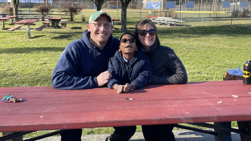 Benjamin with his parents.