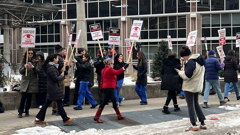 Nurses and technicians from Wills Eye Hospital march outside the facility on Wednesday, Feb. 11 for better wages and job security.