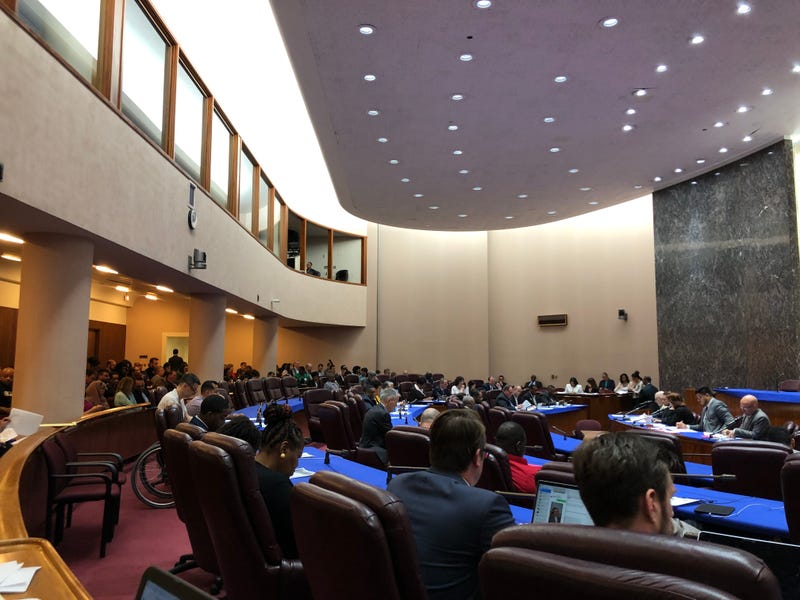 Alderpersons sit in the Chicago City Council chambers.