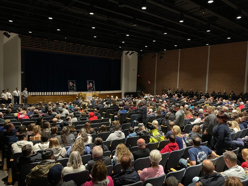 A nearly-full auditorium at Bristol Eastern High School for a vigil in memory of two police officers shot and killed while on duty, 10/13/22