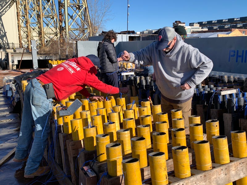 Crews at the Navy Yard prepare fireworks for New Year's Eve 2024.